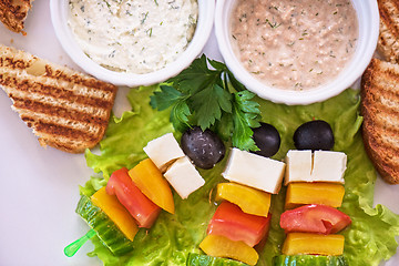 Image showing toast with cheese vegetables and olive on the stick