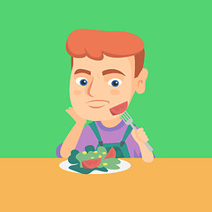 Image showing Boy refusing to eat salad with healthy vegetables.