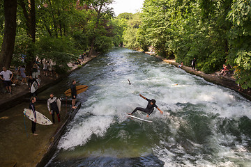 Image showing Surfer surfing an artificial wave in Munich city center, Germany.