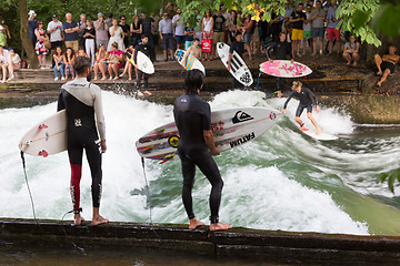 Image showing Surfer surfing an artificial wave in Munich city center, Germany.