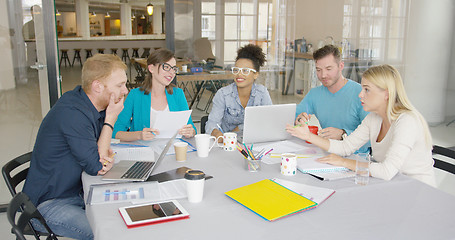 Image showing Young people brainstorming in office