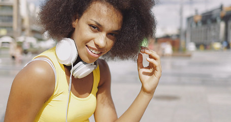 Image showing Model in headphones at street 