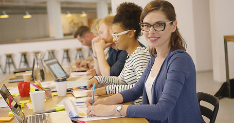 Image showing Smiling worker posing in office