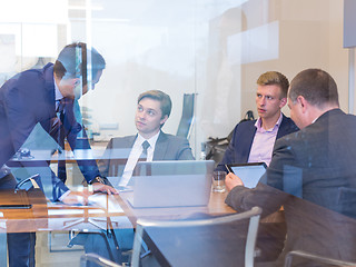 Image showing Business people sitting and brainstorming at corporate meeting.