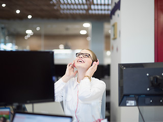 Image showing businesswoman using a laptop in startup office