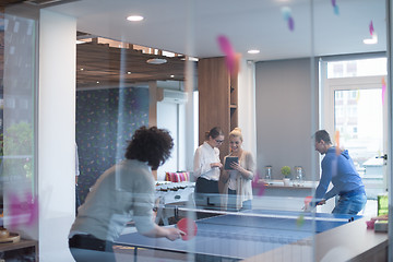 Image showing startup business team playing ping pong tennis