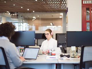 Image showing businesswoman using a laptop in startup office