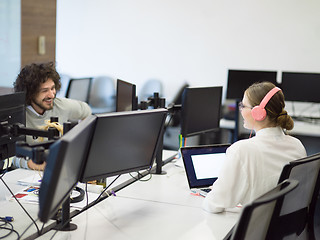 Image showing businesswoman using a laptop in startup office