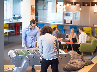 Image showing Office People Enjoying Table Soccer Game
