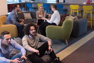 Image showing startup Office Workers Playing computer games