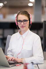 Image showing businesswoman using a laptop in startup office