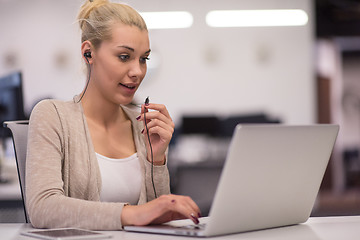 Image showing businesswoman using a laptop in startup office