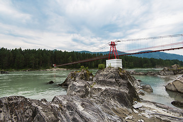 Image showing suspension bridge on mountain river