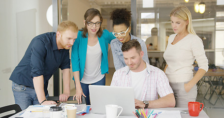 Image showing People watching laptop together