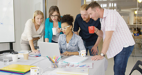 Image showing People watching laptop with interest