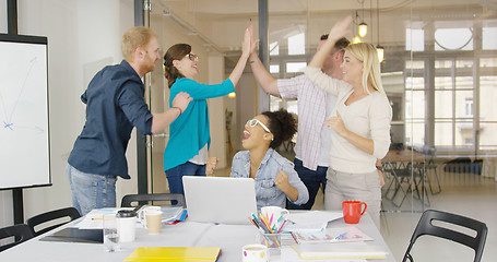 Image showing Workers giving high five