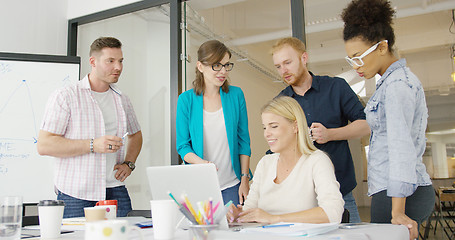 Image showing Coworkers with laptop in office