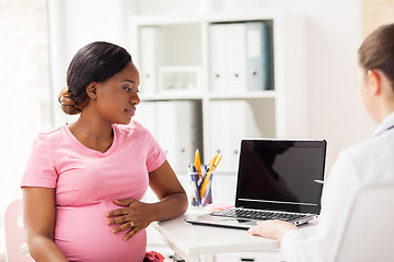 Image showing doctor with laptop and pregnant woman at clinic