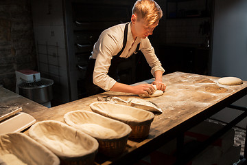 Image showing chef or baker making dough at bakery