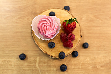 Image showing zephyr or marshmallow with berries on stand