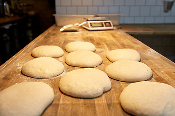 Image showing yeast bread dough on bakery kitchen table