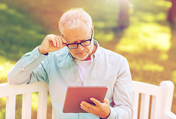 Image showing senior man with tablet pc at summer park