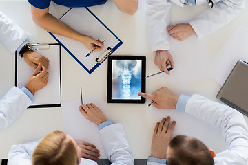 Image showing doctors with spine x-ray on tablet pc computer