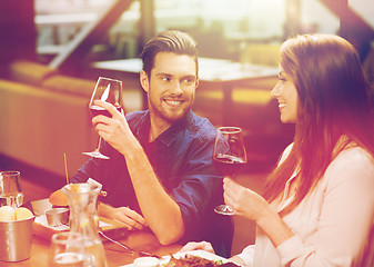 Image showing couple dining and drinking wine at restaurant