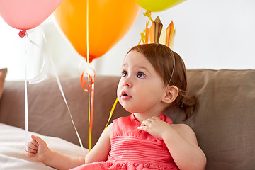 Image showing happy baby girl in crown on birthday party at home