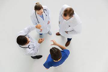 Image showing doctors working with something imaginary at hospital