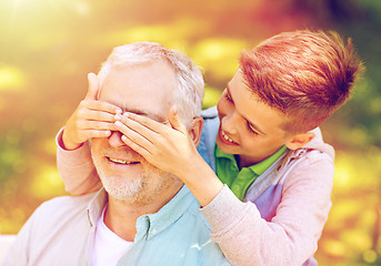 Image showing grandfather and grandson playing at summer park