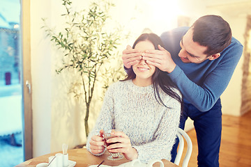 Image showing happy couple drinking tea at cafe