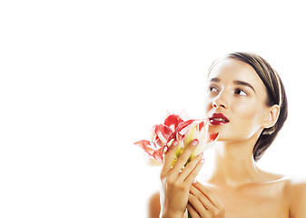 Image showing young pretty brunette woman with red flower amaryllis close up i
