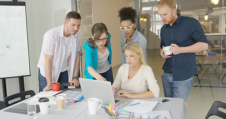 Image showing Coworkers with laptop in office