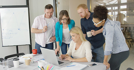 Image showing People in office watching laptop