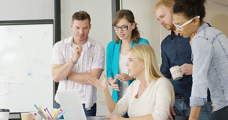 Image showing Young people brainstorming in office