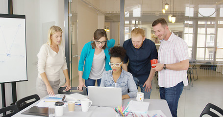 Image showing Colleagues watching information at laptop