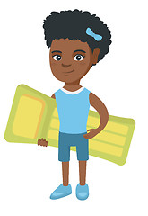 Image showing Little african girl holding inflatable mattress.