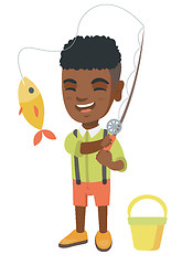 Image showing Little boy holding fishing rod with fish on hook.