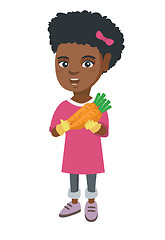 Image showing African-american girl holding fresh carrot.