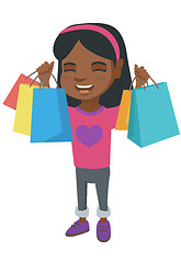 Image showing Happy african-american girl holding shopping bags.