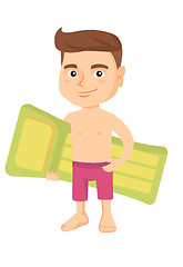 Image showing Little caucasian boy holding inflatable mattress.