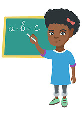 Image showing African schoolgirl writing on the blackboard.