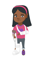 Image showing African sad injured girl with broken arm and leg.