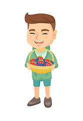 Image showing Boy with the basket of strawberry and blueberry.