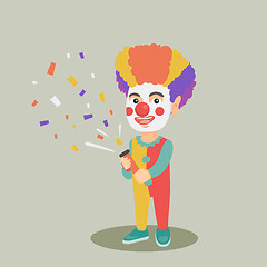 Image showing Clown boy shooting a party popper confetti.