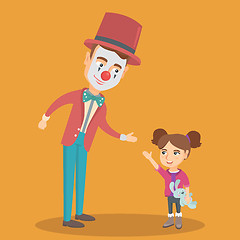 Image showing Little caucasian girl playing with clown.