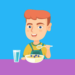 Image showing Caucasian boy eating porridge for breakfast.