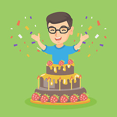 Image showing Little caucasian boy jumping out of a large cake.