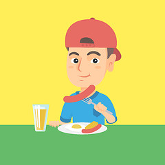 Image showing Boy eating sausage and fried egg for breakfast.
